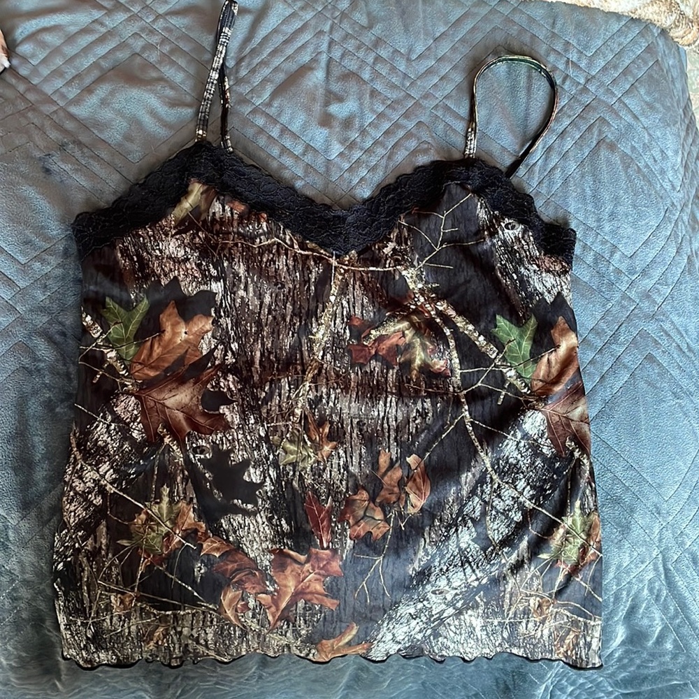 Two wilderness camo sleeping tank tops in excellent condition.